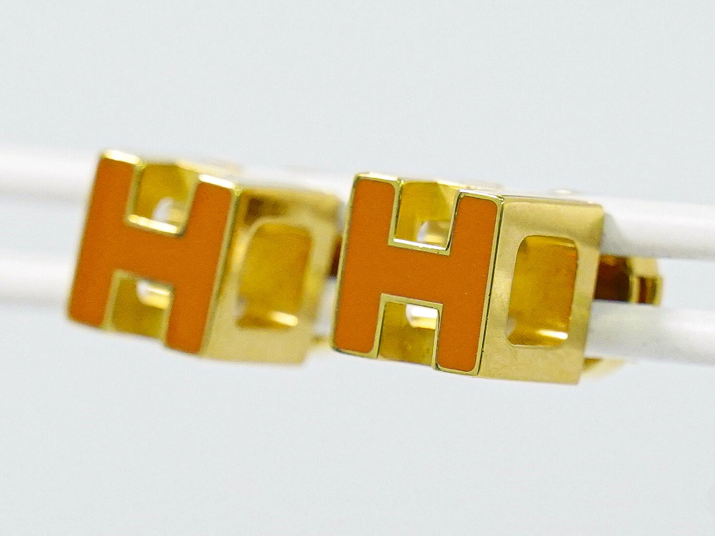 HERMES Hキューブ ピアス GP オレンジ