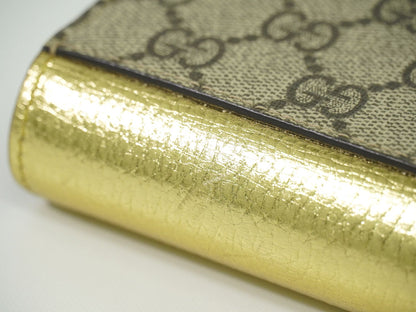 GUCCI GGマーモント 折財布 ベージュ ゴールド 598587